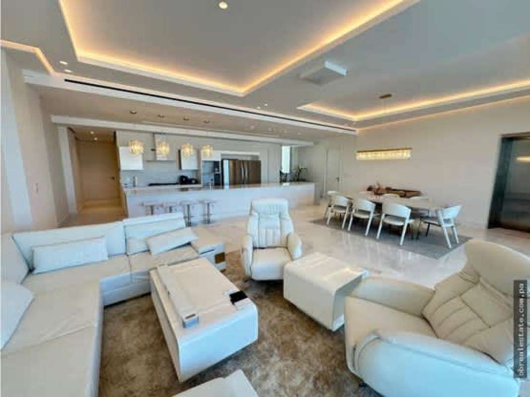 Spacious designer kitchen with large island counter, pendant lighting and stainless appliances in Ocean Reef Island