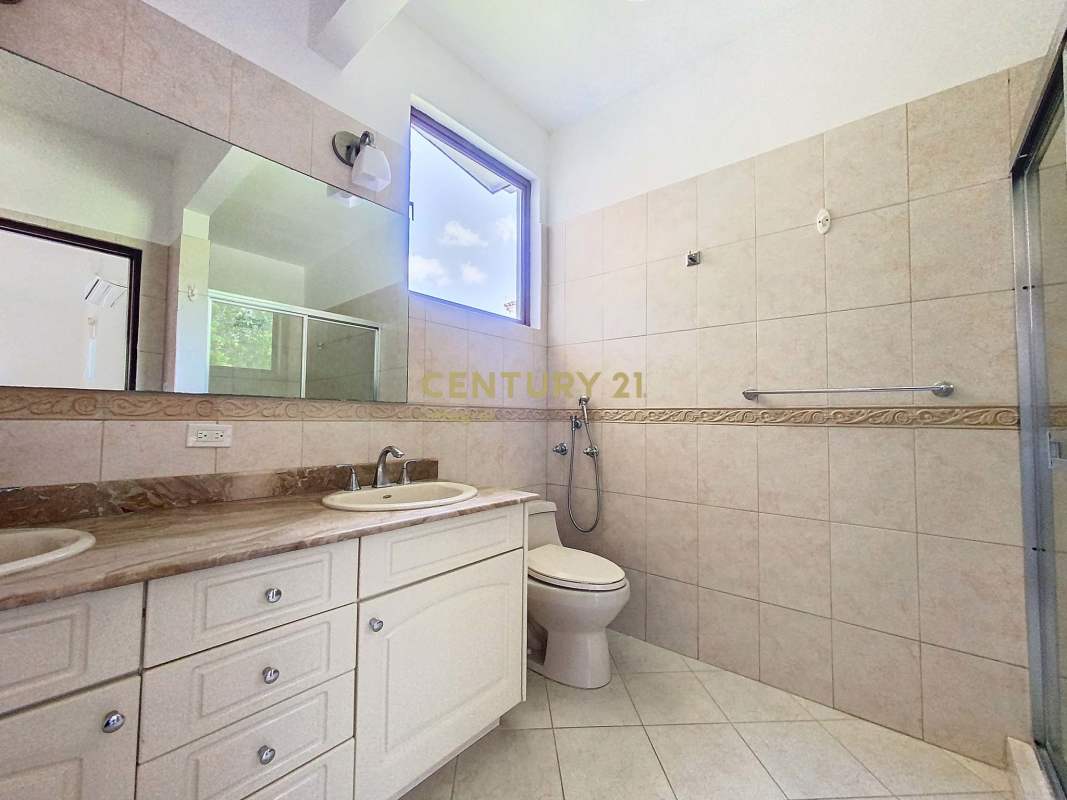 Bathroom with glass-enclosed shower, granite countertop, natural light in PH Camino de Cruces Clayton Panama