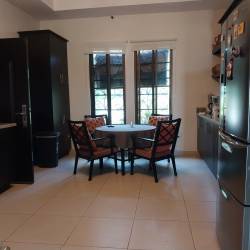 Covered outdoor terrace with BBQ next to guest house San Carlos Panama