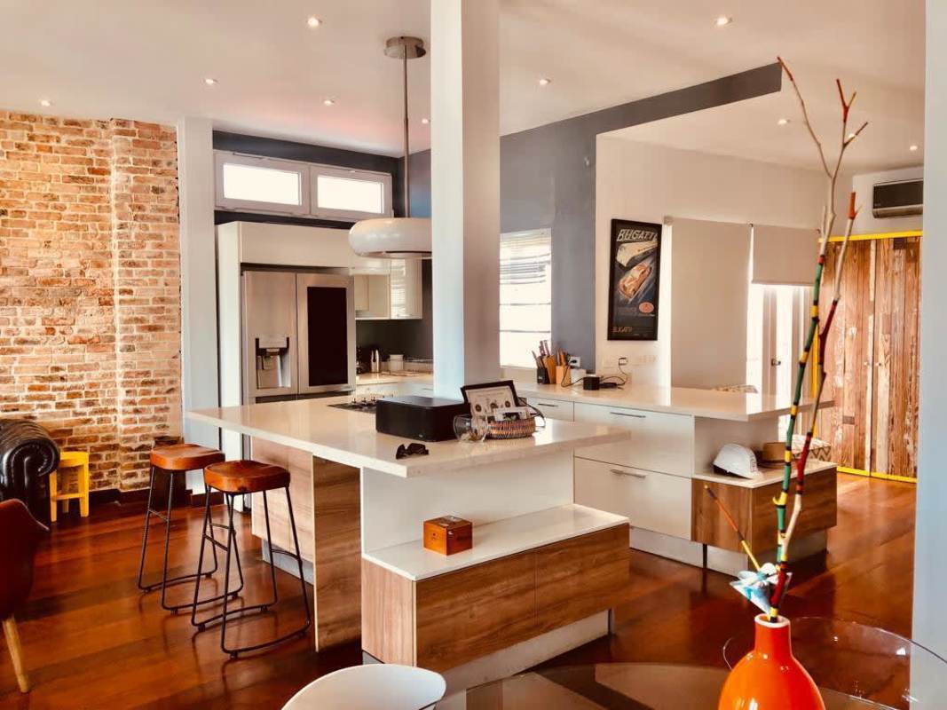 Spacious open living dining area with historic brick wall loft apartment for sale Panama