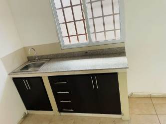 Minimalist bathroom with walk-in shower, pedestal sink, marble effect wall tiles rental David Chiriquí