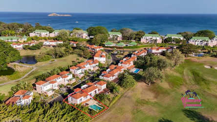 Bright bedroom with large window overlooking garden in Costa Blanca Golf Villas rental Farallon Panama