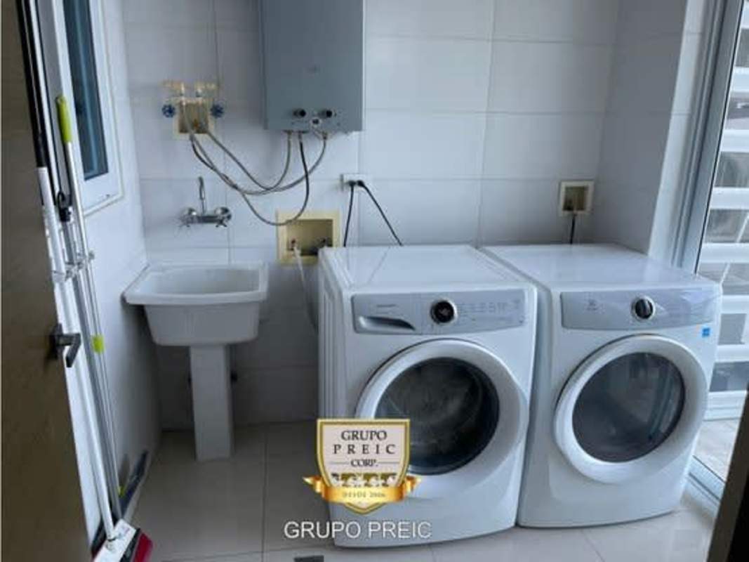 Laundry area with appliances in luxury apartment PH Regent Costa del Este Panama