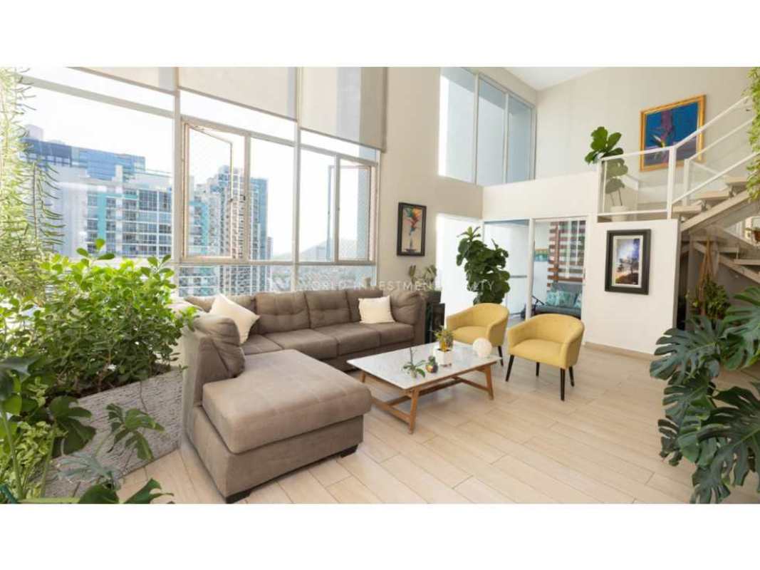 Bedroom space with large window and city skyline view in PH Vista Tower Panama