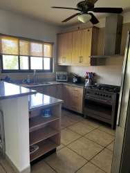 Modern bathroom with glass shower enclosure, porcelain sink, quality fixtures at Vista Mar Golf Villa San Carlos Panama