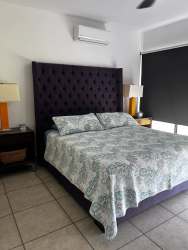 Spacious terrace overlooking landscaped garden and golf course in Villa Paseo Las Olas Vista Mar San Carlos Panama