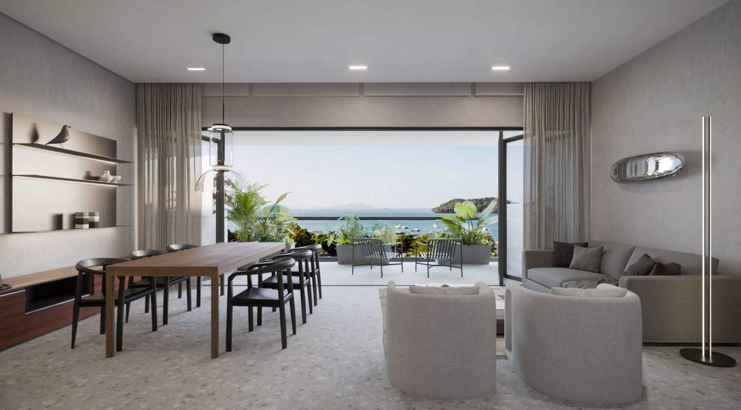 Open living dining space with large balcony and ocean view at Passage Amador Panama City