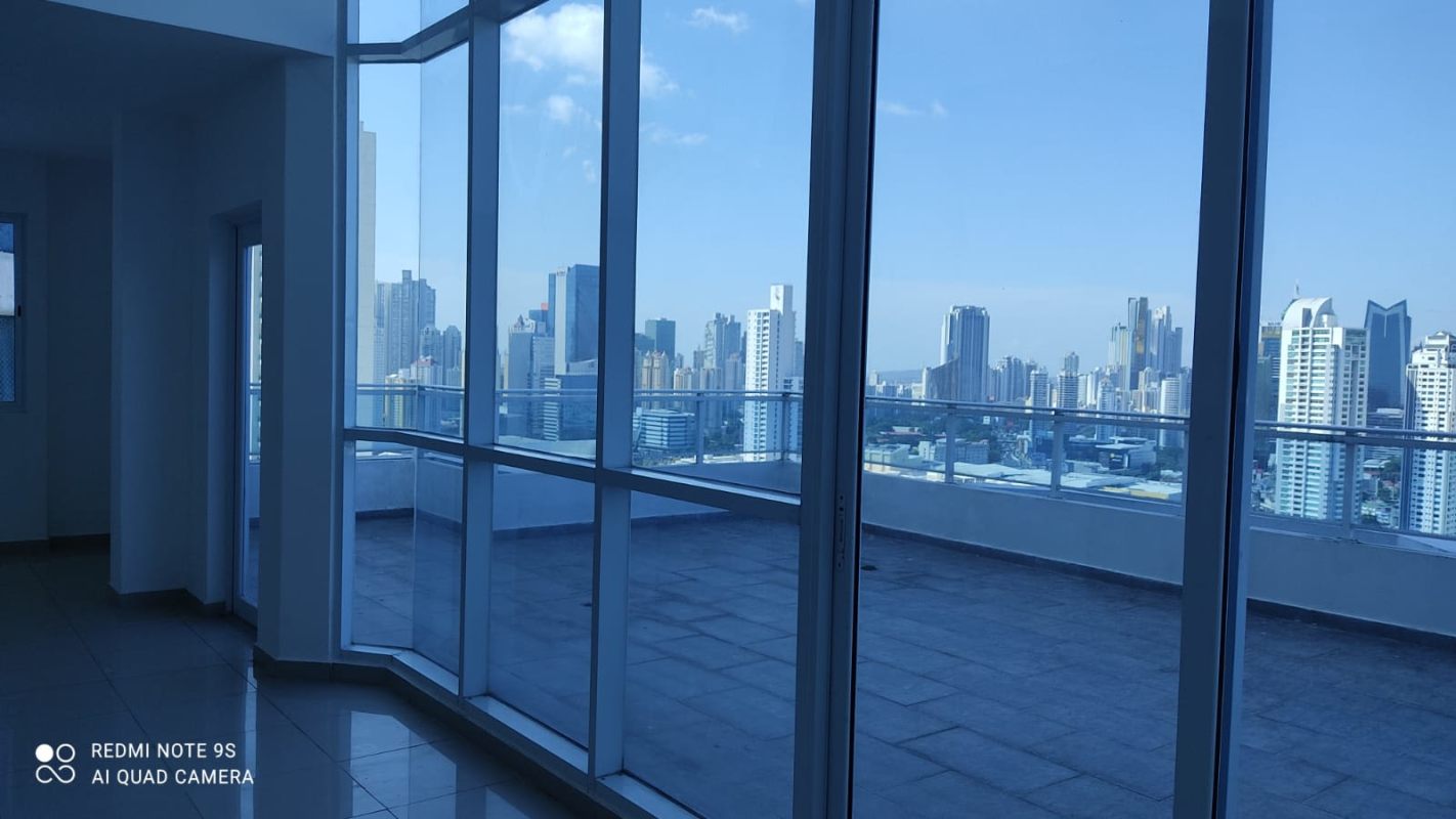 Modern staircase with metal railing connecting two levels in duplex at PH Premium Tower Panama