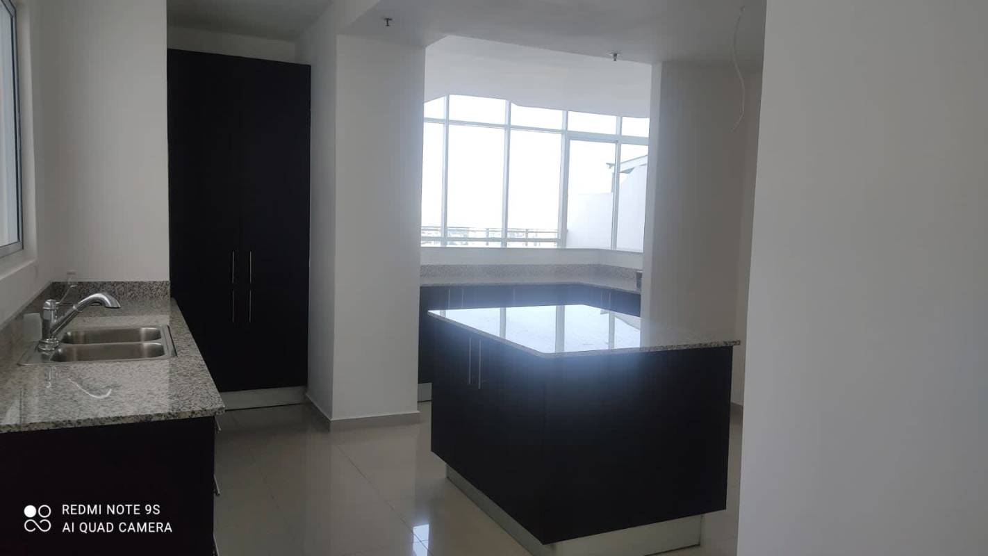 Spacious modern kitchen with granite island, sleek cabinets and appliances at PH Premium Tower San Francisco Panama City