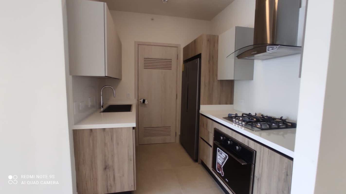 Modern kitchen with quartz countertop and stainless appliances PH Ocean House Santa María Panama