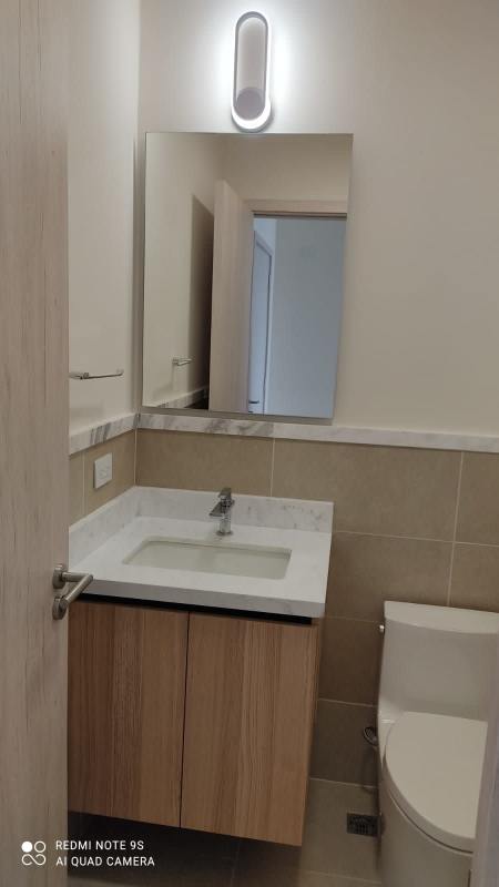 Contemporary bathroom with marble countertop vanity and light wood PH Ocean House Santa María Panama