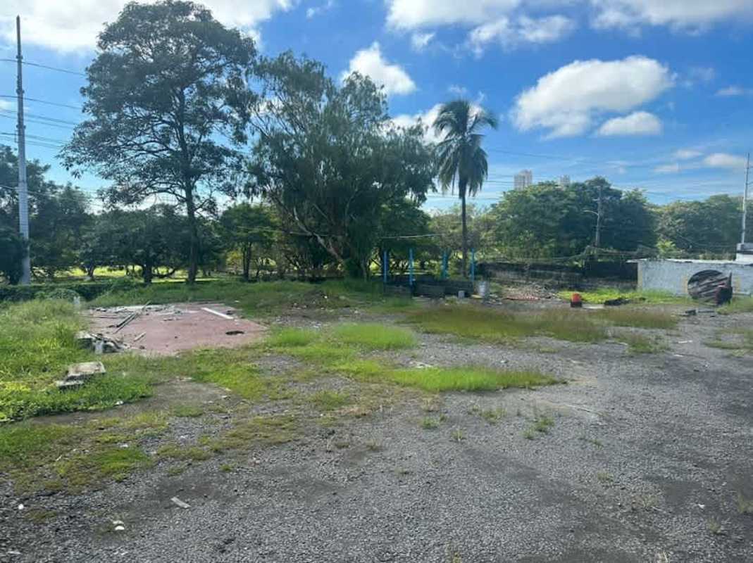 Corner land with metal sliding gate fence and driveway along Santa Elena Avenue Panama