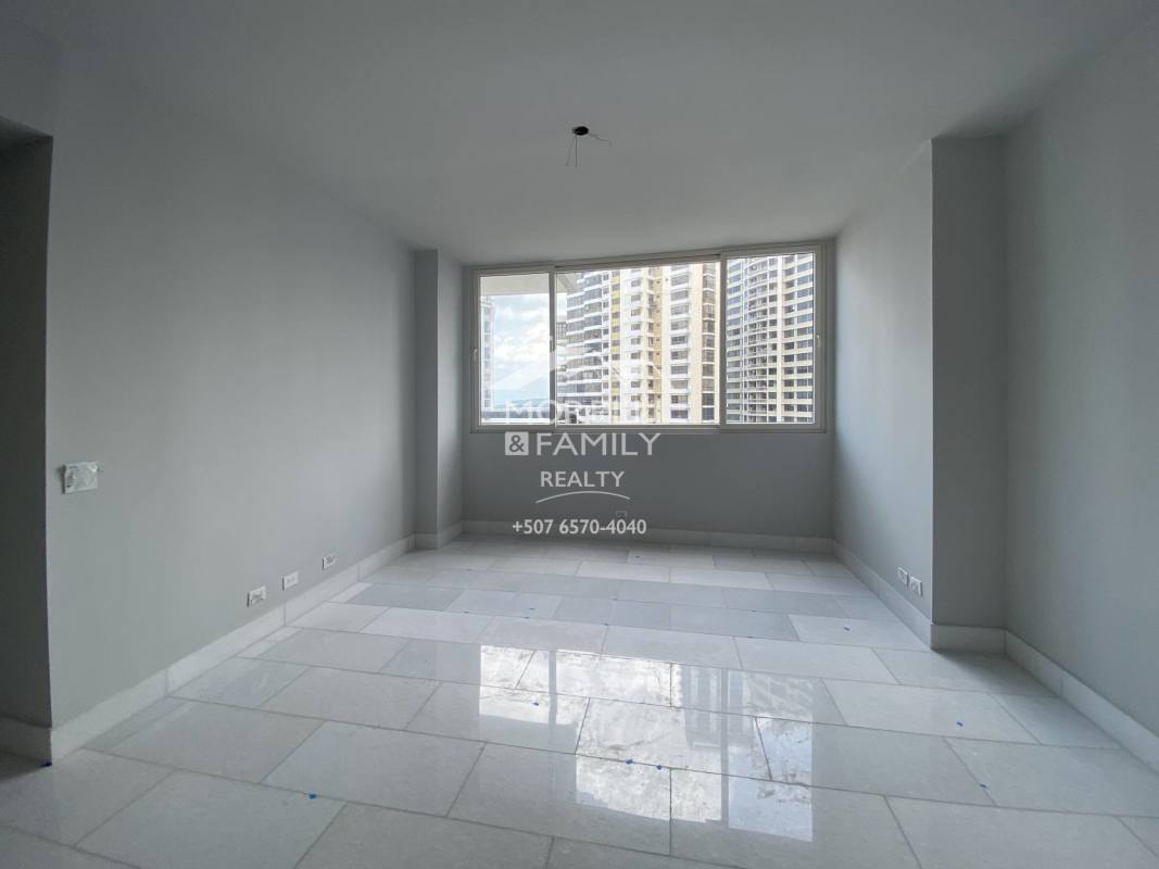 Elegant master bathroom with marble walls, double sinks and glass shower enclosure in The Towers Punta Paitilla Panama