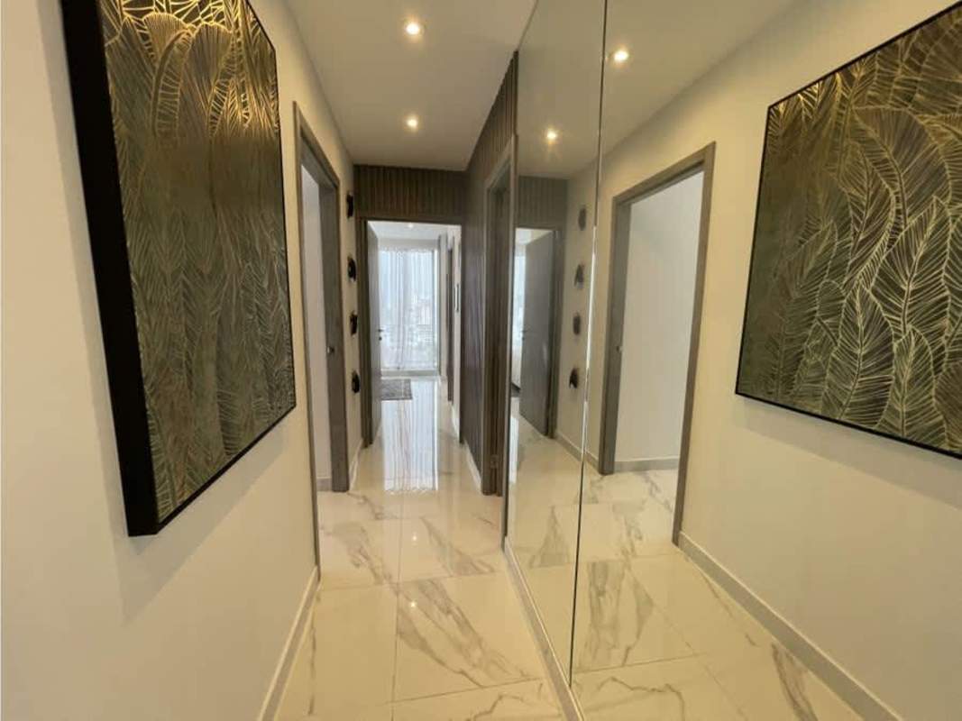 Open living dining space with balcony and city views PH Mini Design Panama