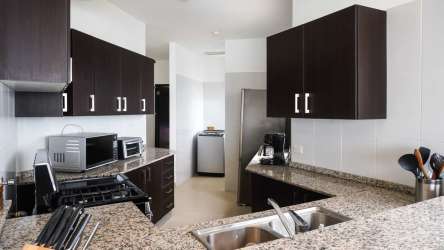 Spacious open plan living dining with large windows, balcony access at PH Patricia Italia Decameron area