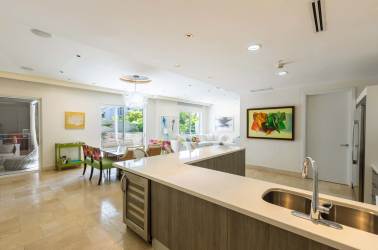 Spacious kitchen and colorful dining area in beachfront Buenaventura condo for sale