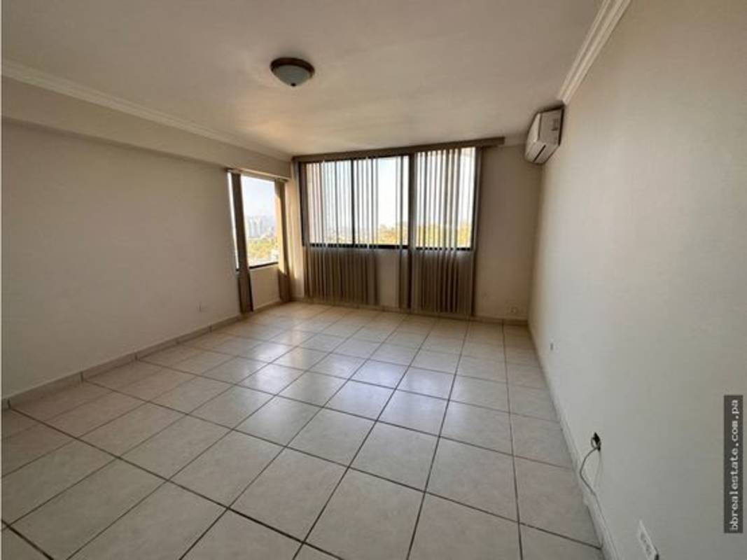 Open living space with large windows, vertical blinds, AC in PH Fountain View Villa de Las Fuentes