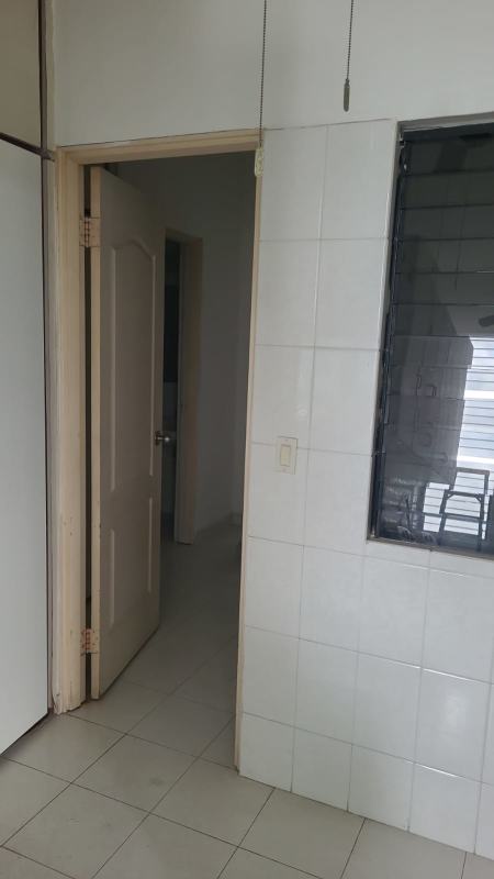 Spacious bedroom with built-in wardrobes and large window with city view at Cresta Palace Panama