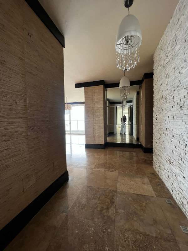 Modern gym with cardio and strength equipment overlooking city skyline PH Q Tower Panama