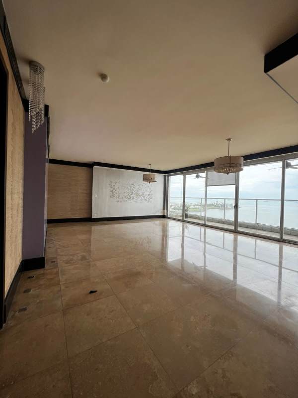 Spacious kitchen with granite countertops, stainless appliances, wood cabinetry in PH Q Tower Punta Pacífica Panama City