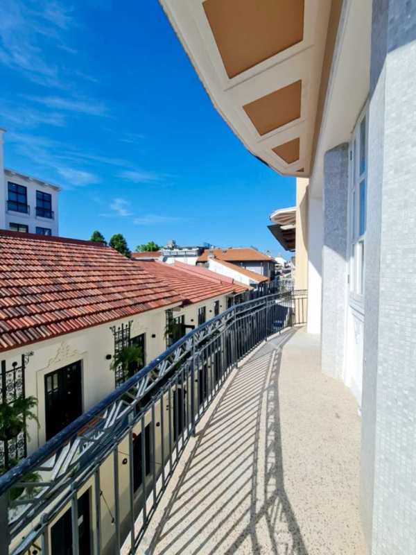 Rooftop terrace with lounge area, ocean views, and BBQ in Casco Viejo Panama City