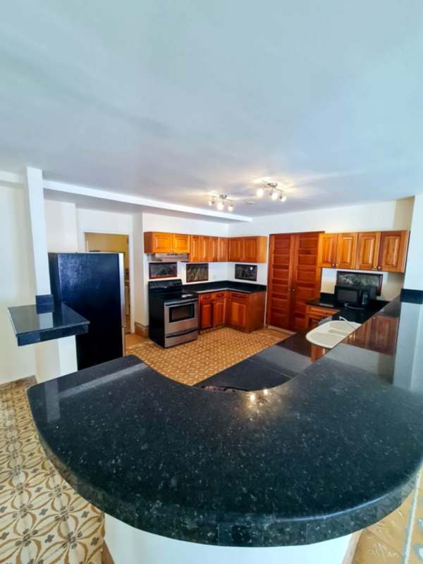 Traditional kitchen with granite countertop, wood cabinets, stainless appliances Casco Viejo Panama