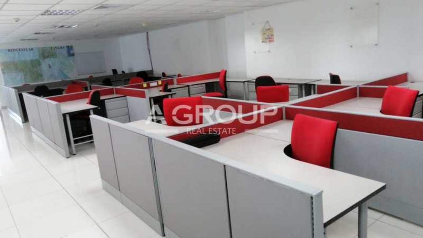 Open-plan office space with cubicles, chairs, modern lighting at Oceania Business Plaza Panama