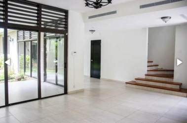Bathroom featuring large mirror, bathtub, glass enclosed shower, beige tiles in Nativa Panama Pacifico