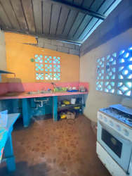 Long hallway with patterned floor tiles, window ventilation blocks and plaster ceiling affordable Panama