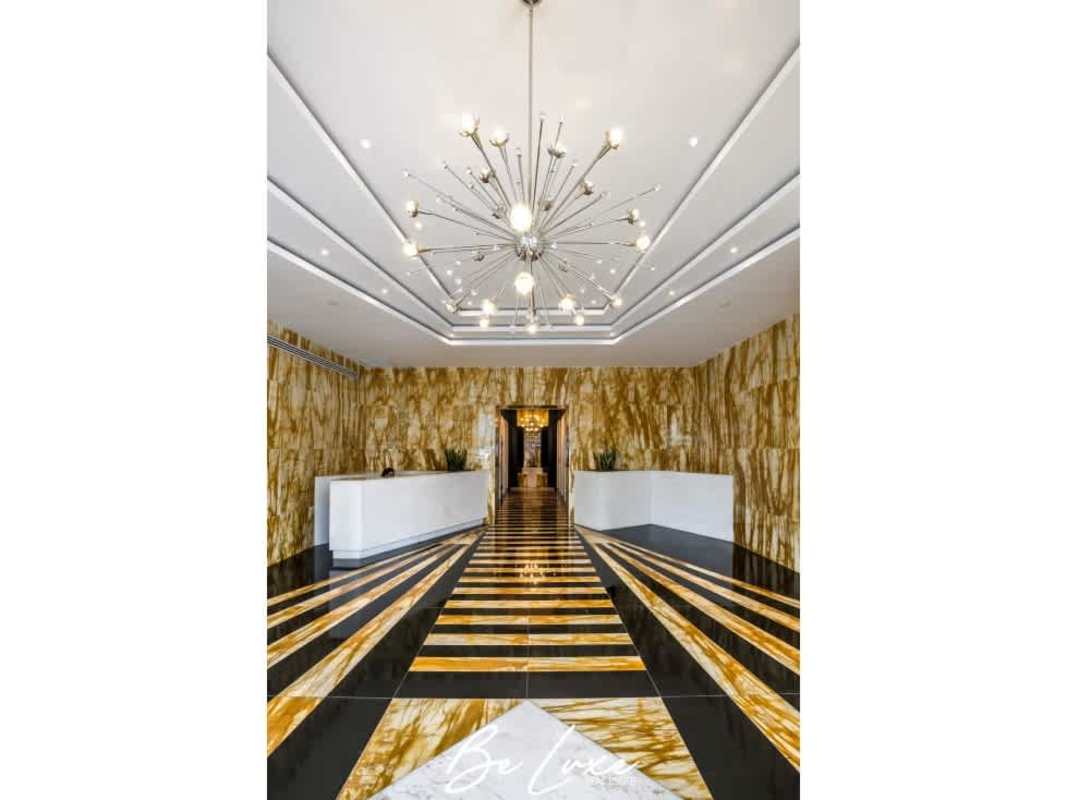 Luxurious marble reception lobby with elevators at PH SFC Tower Obarrio Panama City