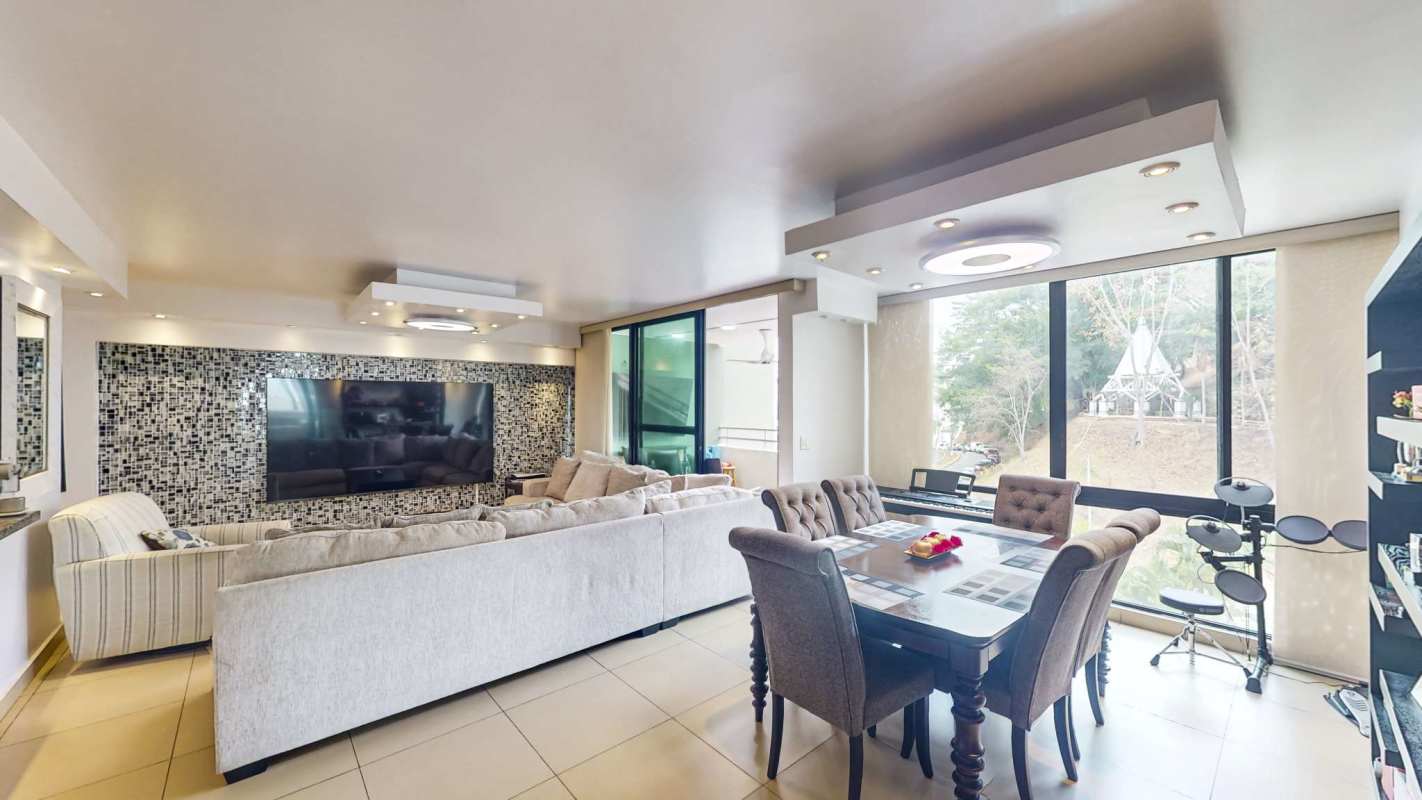 Bright open dining with sofa living area and mosaic wall PH Oceanía 100 Betania