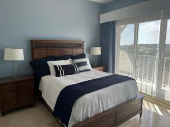 Guest room with full-length windows, ocean views penthouse Buenaventura Panama