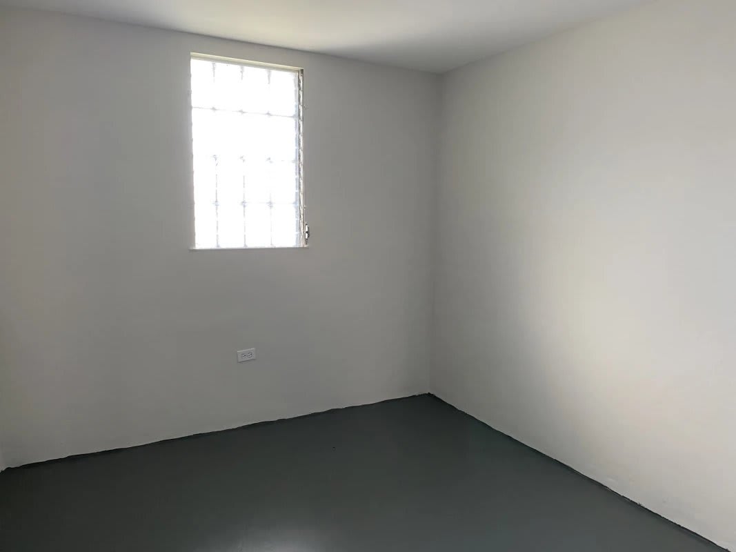 Spacious living dining area with large window natural light in remodeled Tocumen house