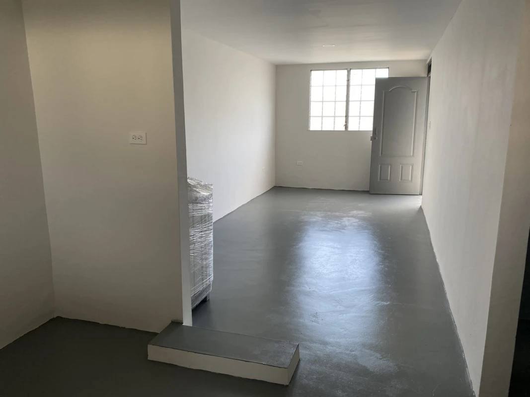 Bedroom with security window, minimalist finish in remodeled Tocumen home