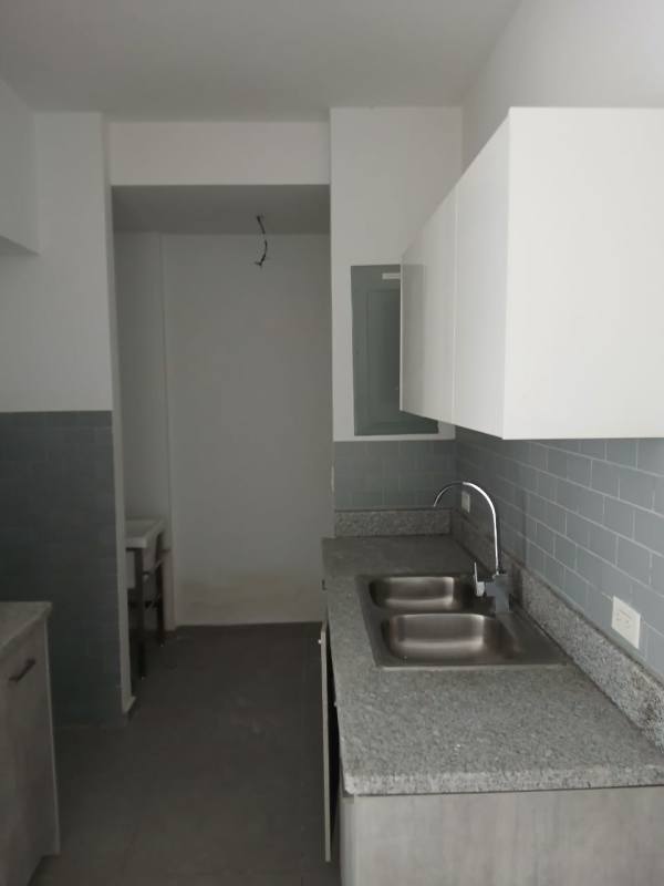 Kitchen featuring granite countertop and blue subway tile backsplash in Signature Point La Cresta Panama