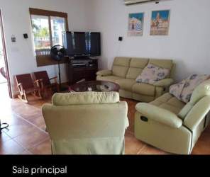 Bathroom with blue and white tiles, shower and vanity Playa Blanca house Panama