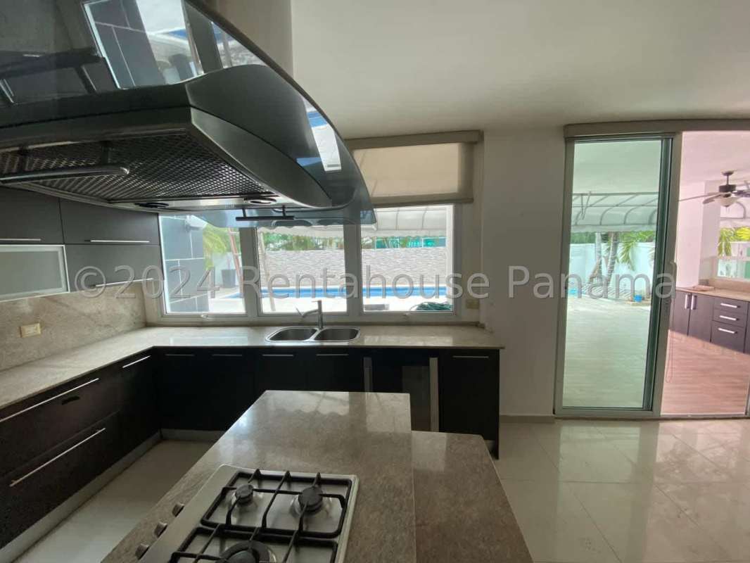 Contemporary kitchen granite countertops gas stove stainless appliances Costa Sur Panama