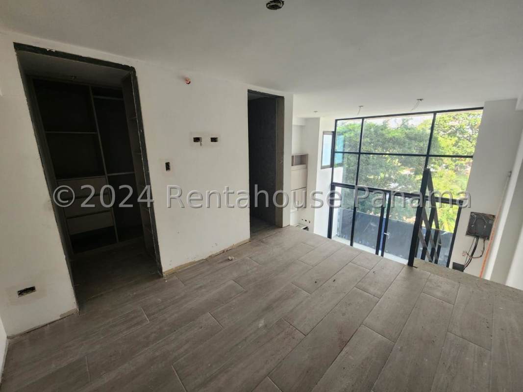 Modern double-height loft interior with floor-to-ceiling windows in PH Dovle Coco del Mar Panama