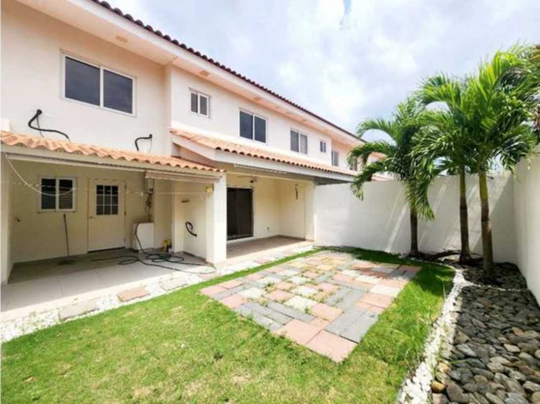 Fenced backyard garden patio tiled Mediterranean style.house at PH Versalles Costa Sur Panama