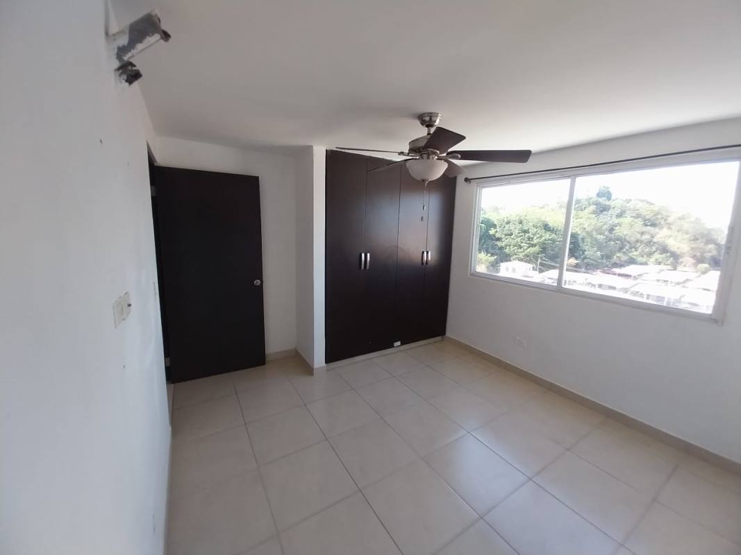 Spacious open floor plan living/dining with ceiling fans and kitchen view PH Altavista Tower Panama