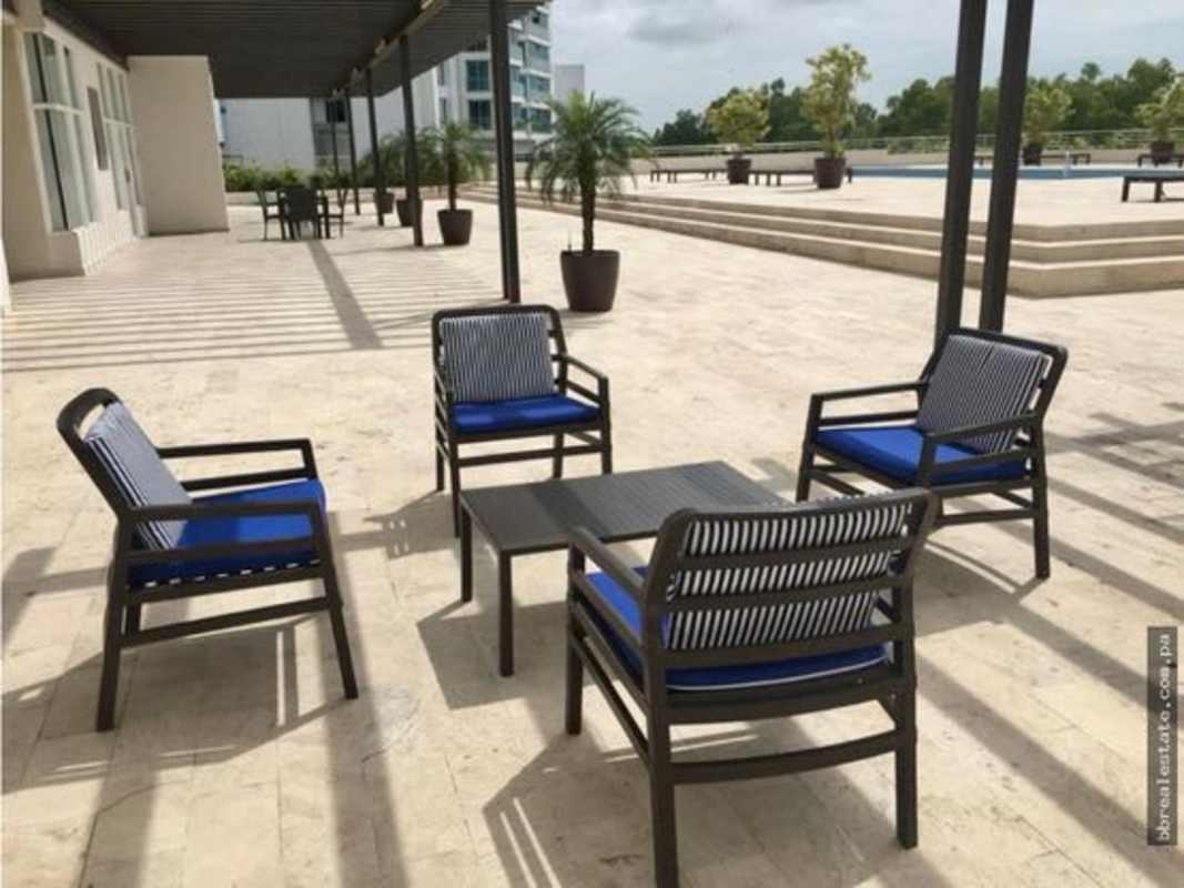 Contemporary dining room with seating for twelve, floor-to-ceiling windows with city views at PH Zeus Costa del Este Panama