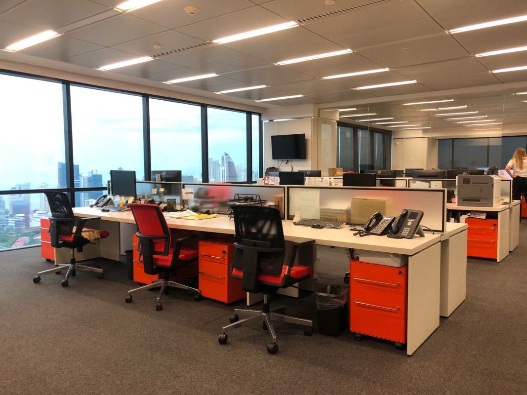 Furnished open office area with cubicles and panoramic city views in PH BICSA Tower