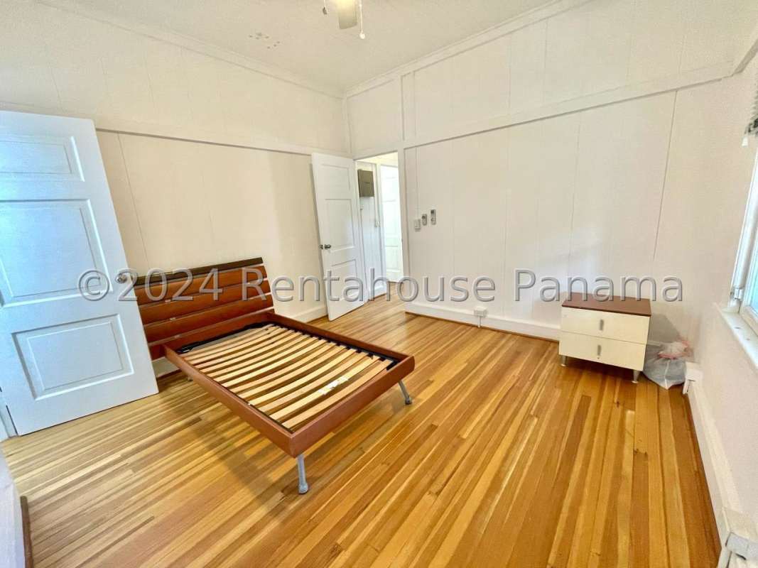 Large living room with original wood floors, big windows in Corozal Ancón Panama