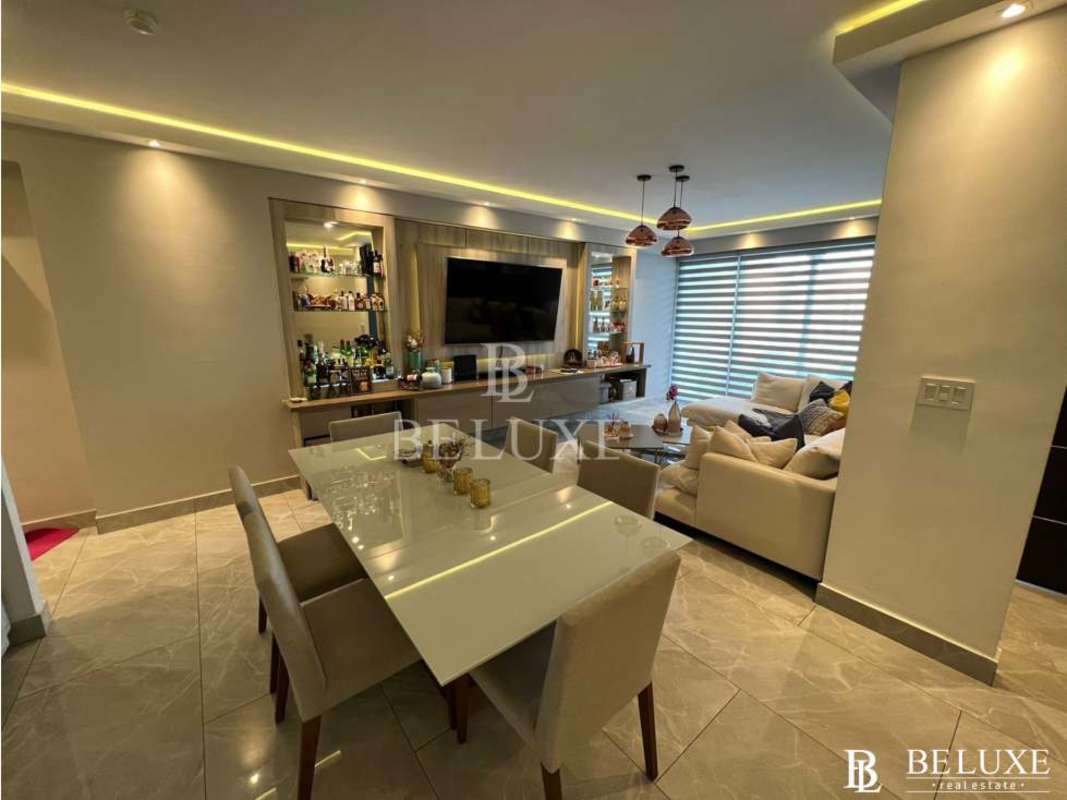 Bright spacious master bedroom with city skyline view at PH Premium Tower