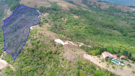 Aerial hillside lot with nearby house and pool for sale near Laguna de San Carlos Panama