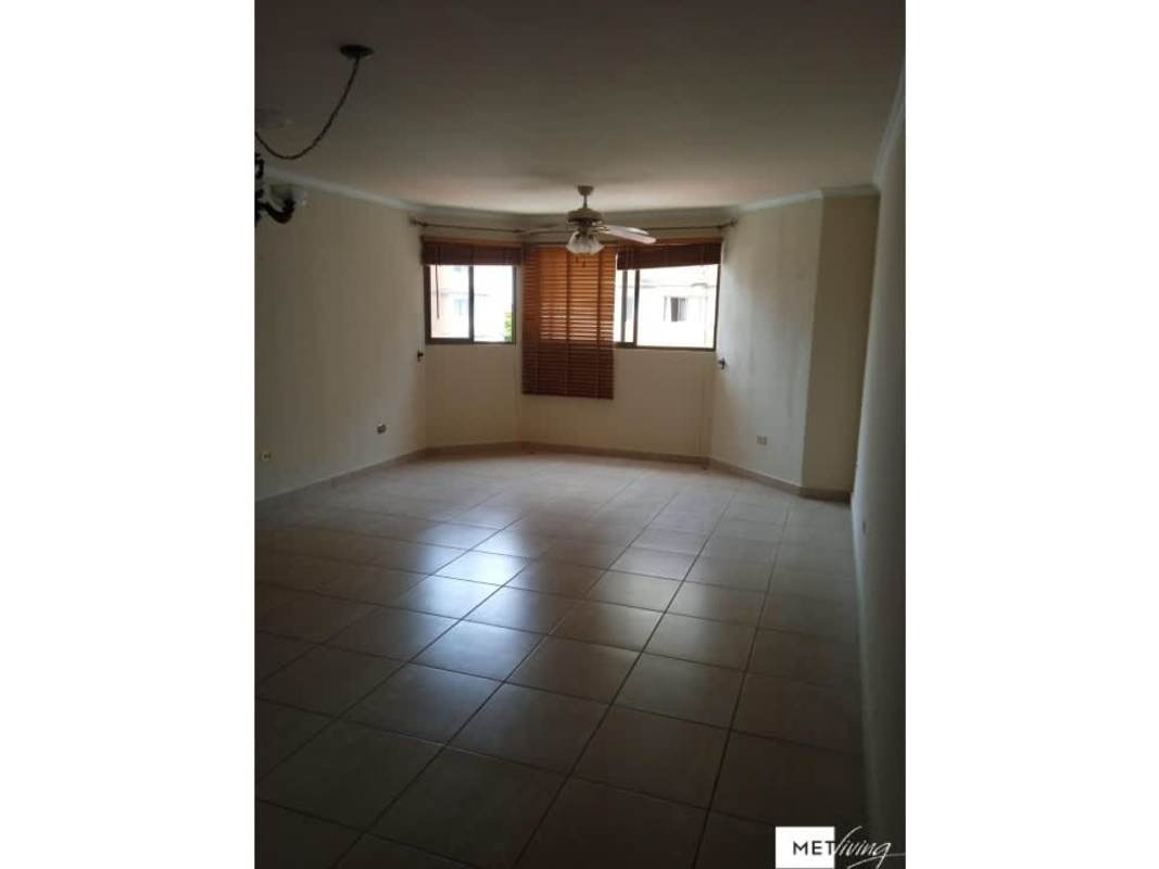 Empty bedroom with tiled floors and large window in PH Parque Versalles Panama City