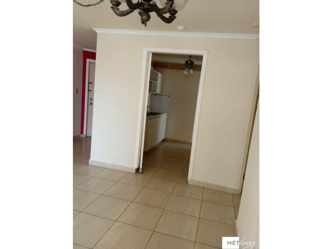 Kitchen area with white cabinets, ceramic tile backsplash in PH Parque Versalles Panama City