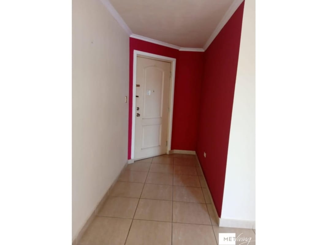 Modern bathroom with walk-in shower, vanity mirror and tiles in PH Parque Versalles Panama City