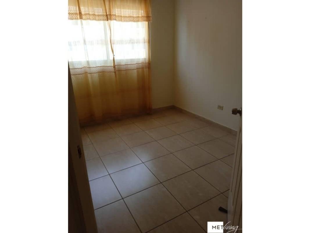 Bedroom with neutral paint tile floor and window curtain PH Parque Versalles