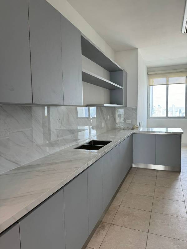 Remodeled modern kitchen with marble countertops, open shelving in Pacific Village Punta Pacifica Panama